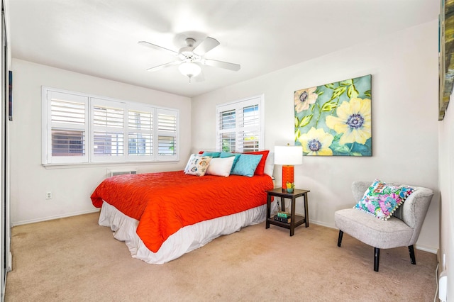 bedroom with ceiling fan and light colored carpet