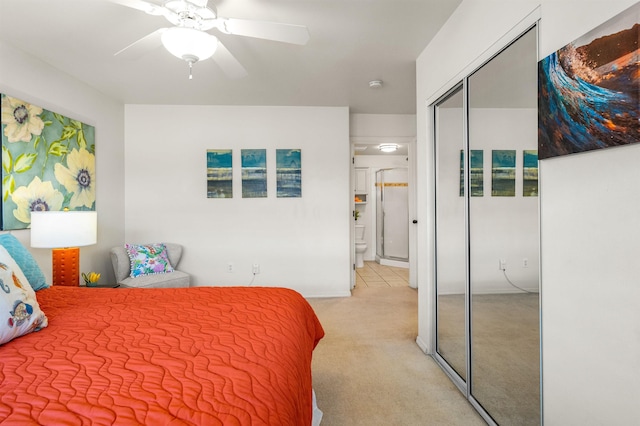 bedroom featuring a closet, ceiling fan, and light colored carpet