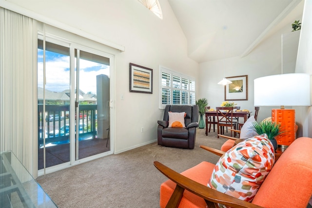 carpeted living room featuring vaulted ceiling