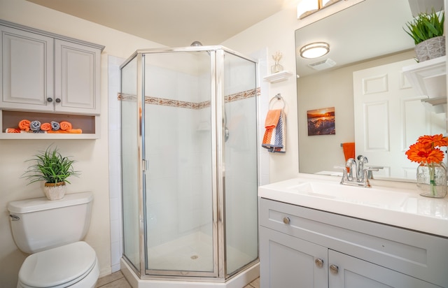 bathroom with toilet, walk in shower, and vanity