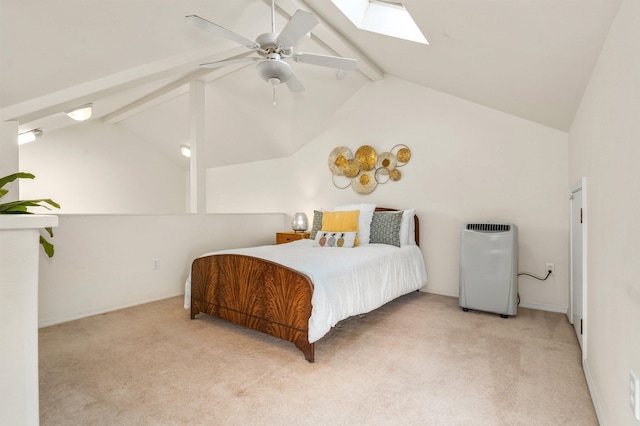 carpeted bedroom with ceiling fan and lofted ceiling with skylight