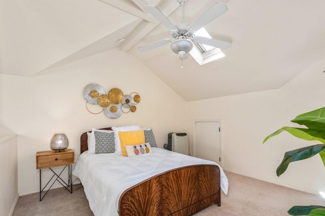 carpeted bedroom featuring ceiling fan and lofted ceiling with skylight