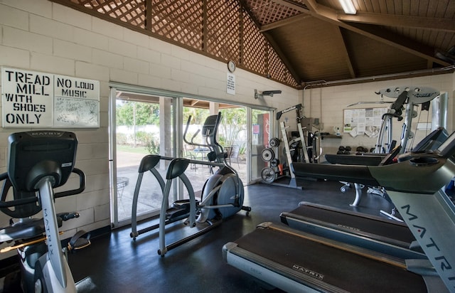 workout area featuring wooden ceiling and vaulted ceiling