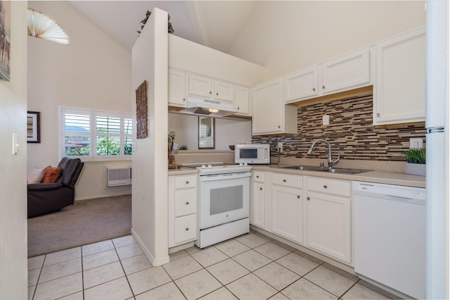 kitchen with sink, white cabinetry, light tile patterned flooring, white appliances, and decorative backsplash