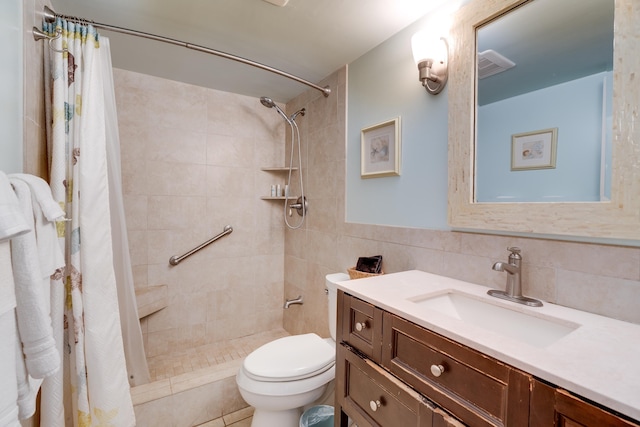 2142 Iliili Rd Unit 303, Kihei, HI 96753 - bathroom with vanity, a tile shower, and tile walls