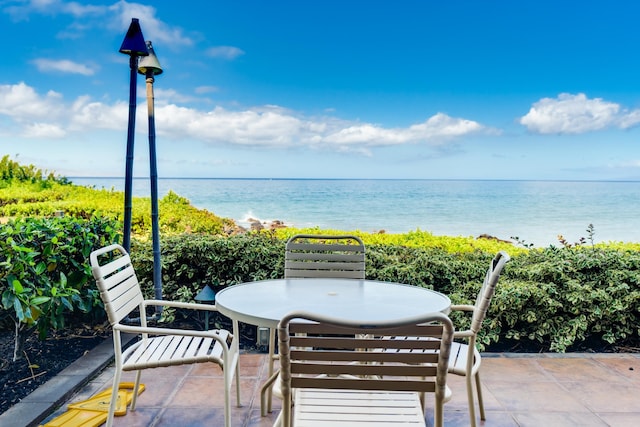 2142 Iliili Rd Unit 303, Kihei, HI 96753 - view of patio / terrace featuring a water view and outdoor dining space