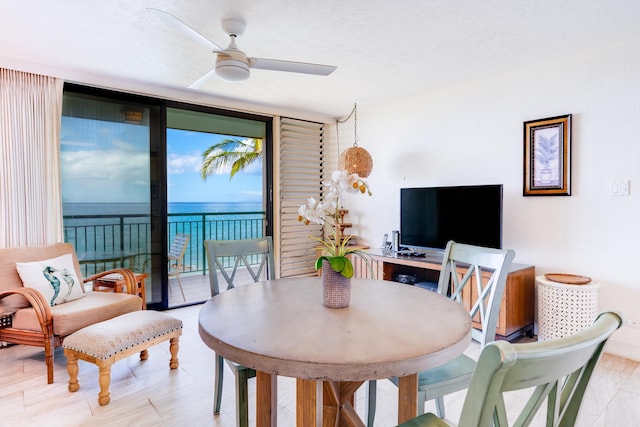 2142 Iliili Rd Unit 303, Kihei, HI 96753 - dining room featuring floor to ceiling windows and a ceiling fan