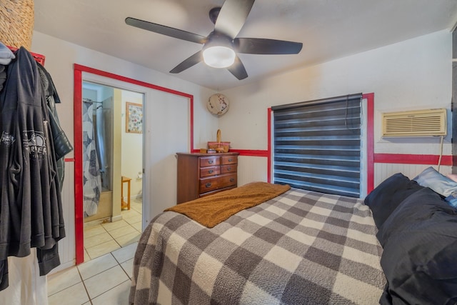 tiled bedroom with ceiling fan, a closet, and an AC wall unit