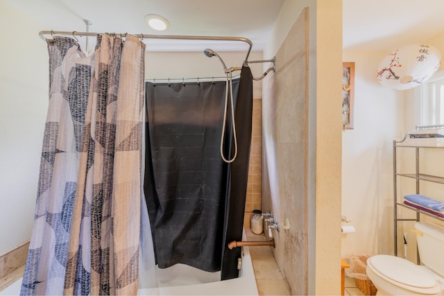 bathroom featuring tile patterned floors, toilet, and a shower with shower curtain