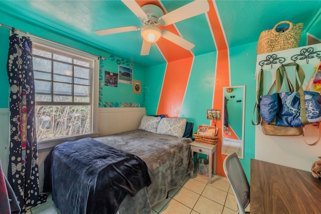 tiled bedroom with ceiling fan