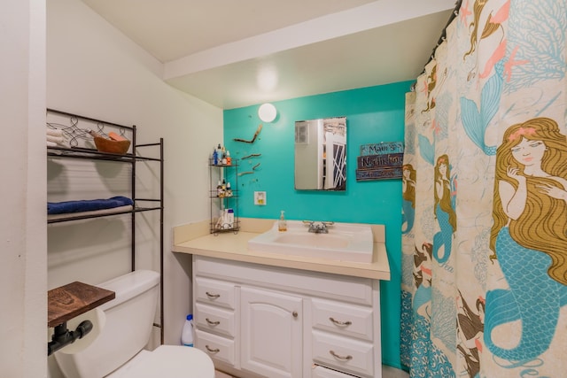 bathroom with toilet and vanity