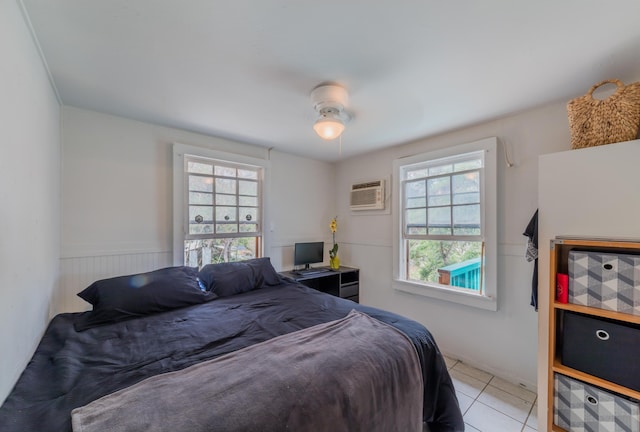 tiled bedroom featuring ceiling fan and an AC wall unit