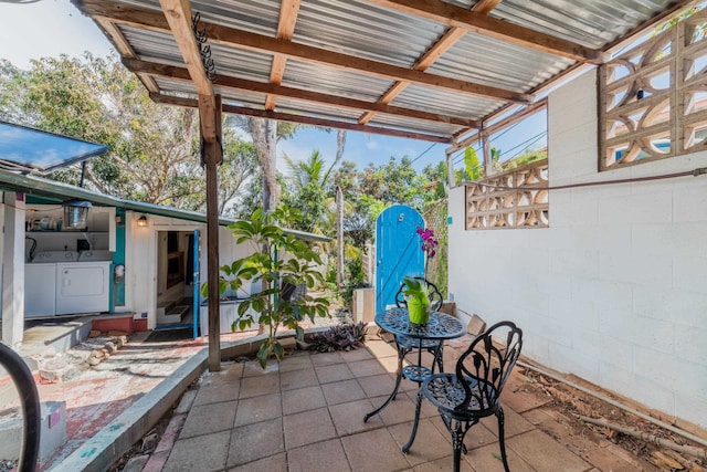 view of patio with washer and dryer