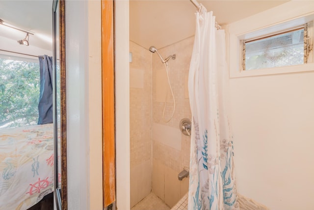 bathroom with a shower with shower curtain