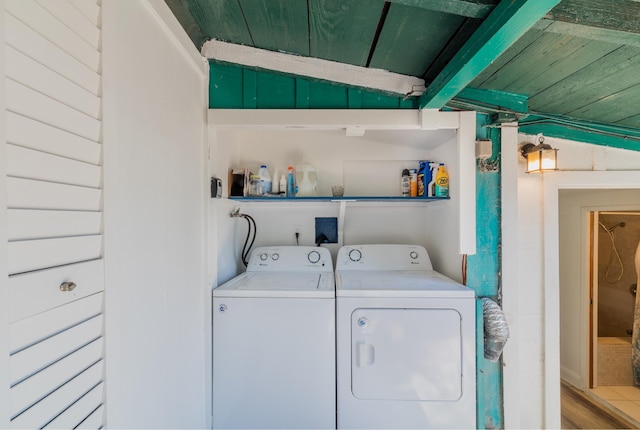 laundry area with washer and clothes dryer and wood ceiling