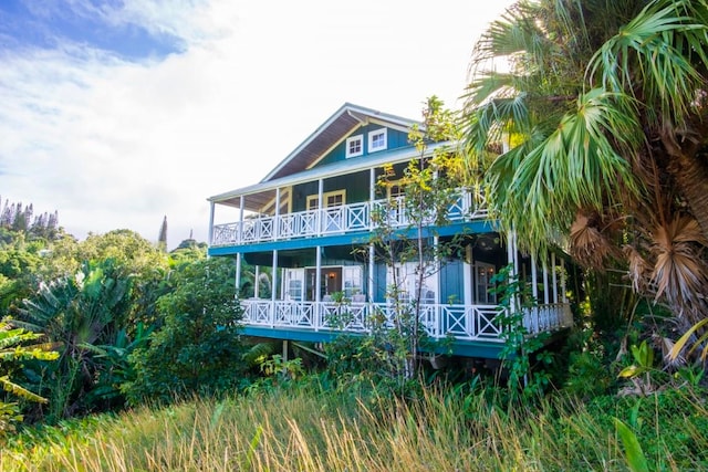 back of house with a balcony