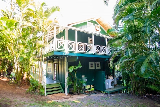 back of house with a porch