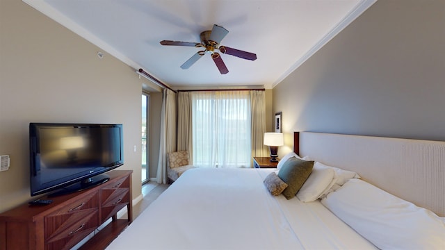 bedroom with ceiling fan, hardwood / wood-style floors, and ornamental molding