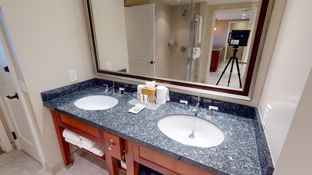 bathroom featuring walk in shower, tile patterned floors, and vanity