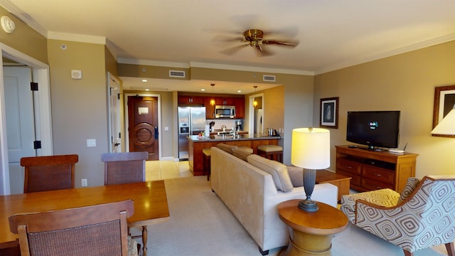 living room featuring light tile patterned flooring, ornamental molding, and ceiling fan