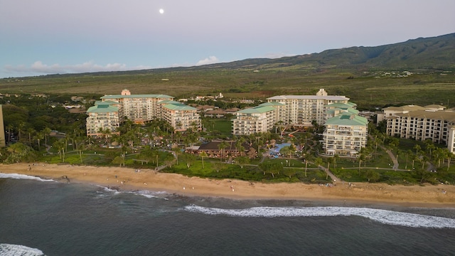 birds eye view of property with a view of the beach and a water and mountain view