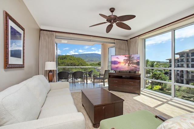 living area with a wealth of natural light and ceiling fan