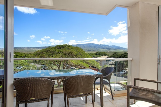 balcony featuring a mountain view