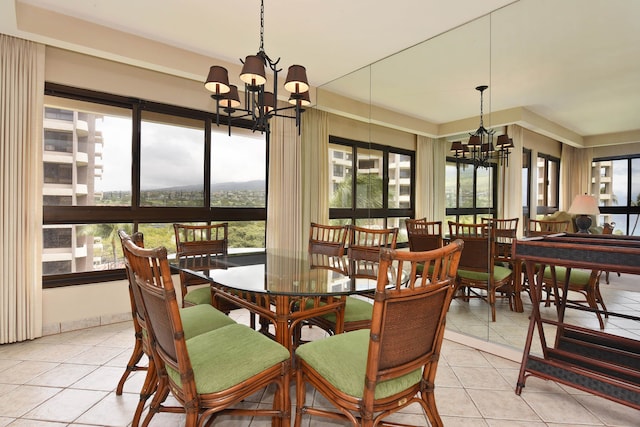 tiled dining area with a chandelier