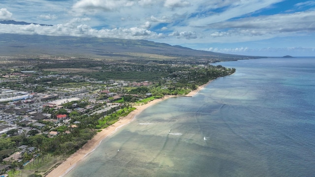 drone / aerial view featuring a water and mountain view