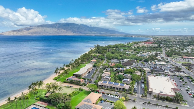 drone / aerial view featuring a water and mountain view