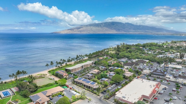 drone / aerial view featuring a water and mountain view