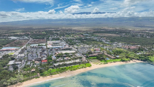 aerial view featuring a water view and a beach view