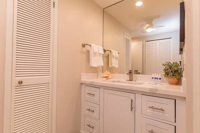 bathroom with ceiling fan and vanity