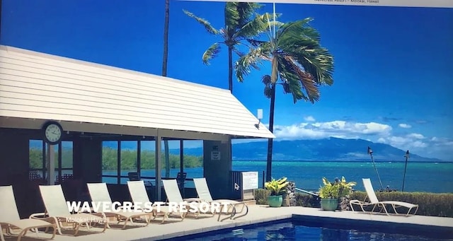 view of swimming pool featuring a gazebo and a water and mountain view