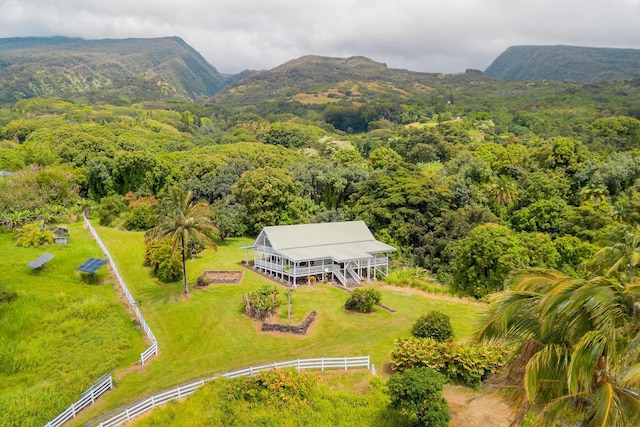 drone / aerial view featuring a forest view and a mountain view