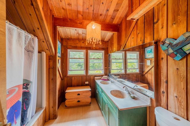 full bathroom with wooden walls, wood ceiling, toilet, and wood finished floors