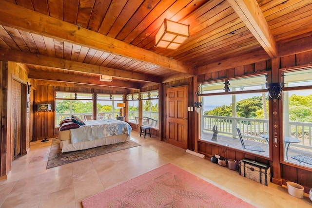 bedroom featuring wooden walls, wooden ceiling, and access to exterior