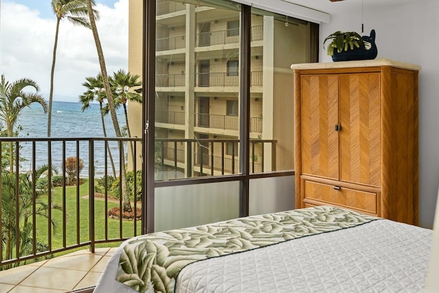 tiled bedroom featuring a water view