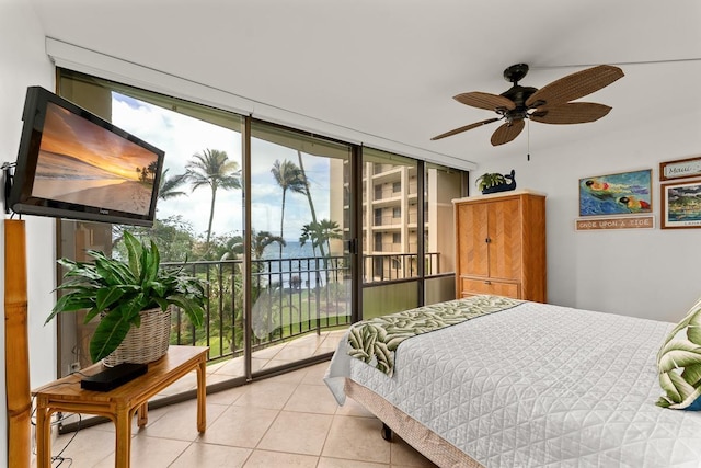 tiled bedroom with ceiling fan, access to outside, and floor to ceiling windows