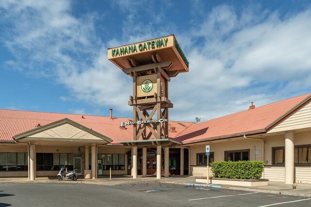 view of property featuring uncovered parking