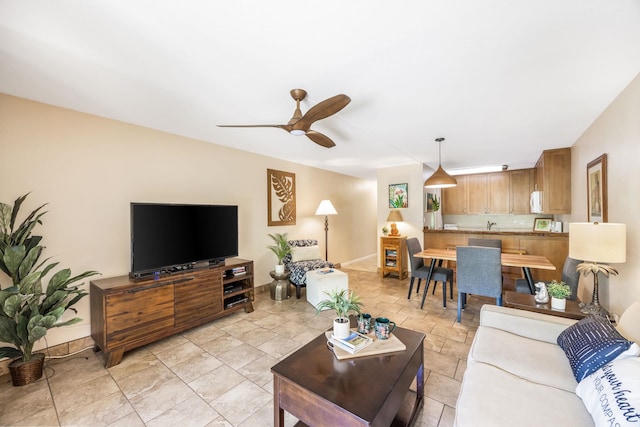 living room with a ceiling fan