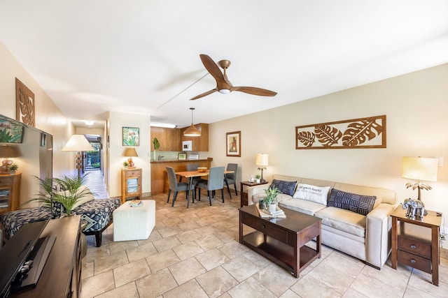 living room featuring a ceiling fan