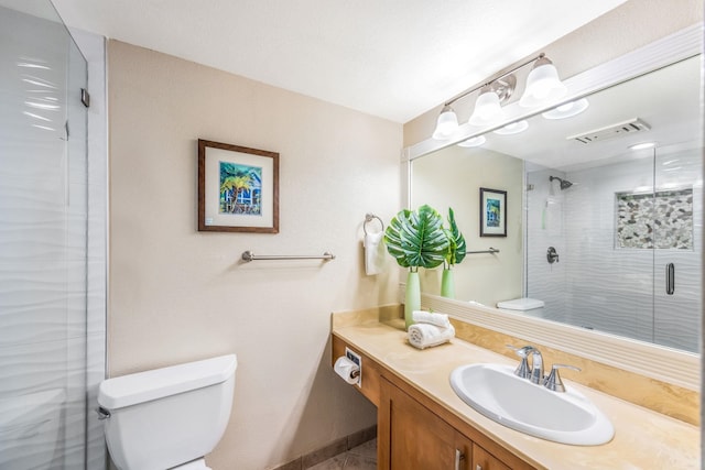 full bath featuring visible vents, a shower stall, toilet, and vanity