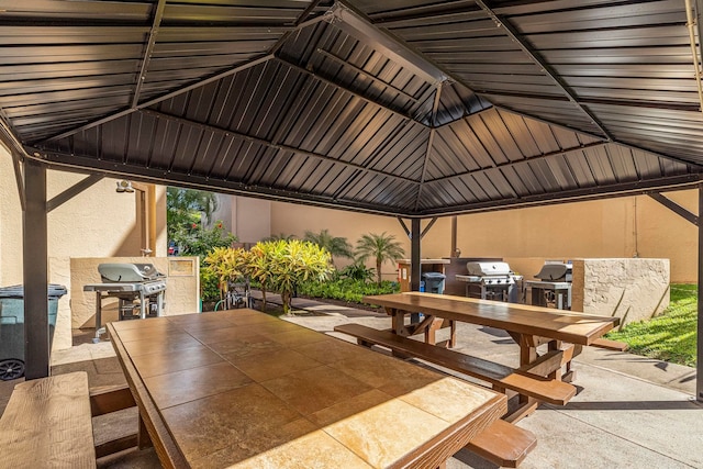 view of patio / terrace featuring outdoor dining space, a gazebo, and grilling area