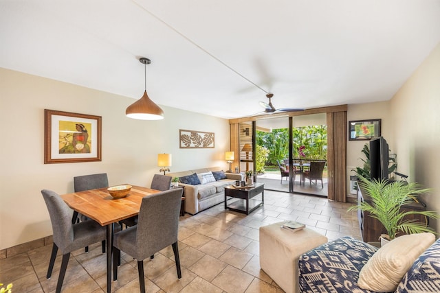 dining room with light tile patterned floors and ceiling fan