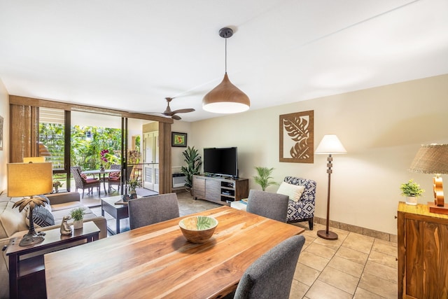 dining area featuring light tile patterned floors and baseboards