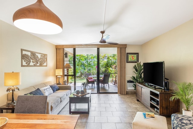 living area featuring a wall of windows, light tile patterned floors, and a ceiling fan