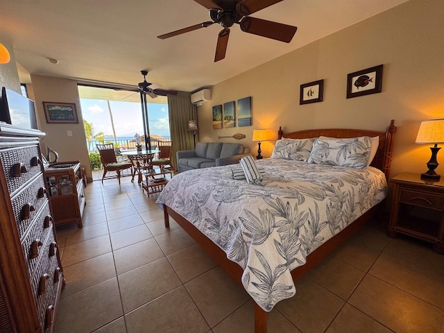 bedroom featuring floor to ceiling windows, access to exterior, a wall unit AC, and tile patterned flooring
