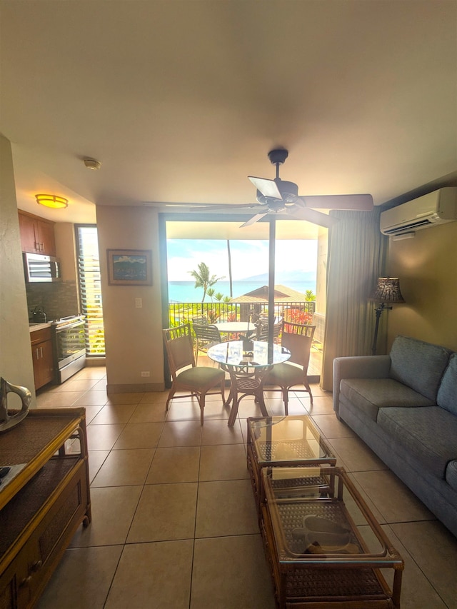 tiled living room with a wealth of natural light, an AC wall unit, and ceiling fan