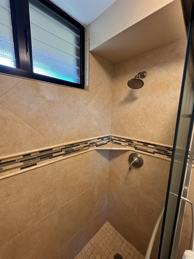 bathroom featuring a stall shower